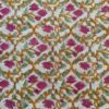 Multicolor floral fabric with yellow, purple, and green motifs