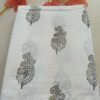 White Kota Doria fabric with large palm tree motifs