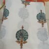 Handcrafted fabric with purple and green circular floral designs