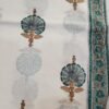 Kota Doria fabric with gold and black floral motifs