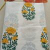 Kota Doria fabric with yellow floral motifs and border
