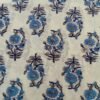 White Kota Doria fabric with small blue floral patterns