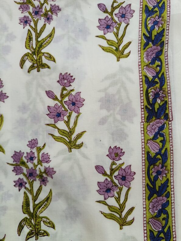 White fabric with teal and pink floral designs