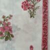 White fabric with small multicolor floral print