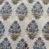 White fabric with large yellow sunflower-style block print