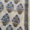 Kota Doria fabric with large red and green floral designs